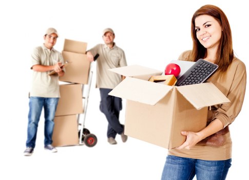Helper carrying boxes from a Camden flat with narrow stairs