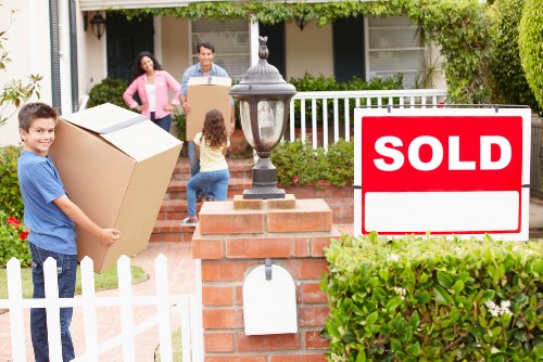 Local movers handling furniture in a Camden apartment building
